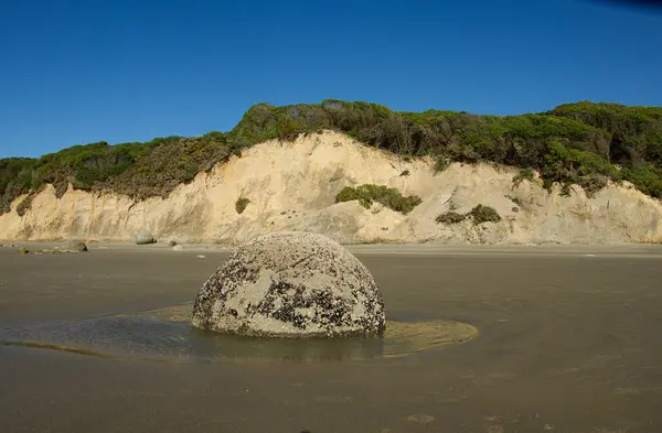 stock image Popular destination to see the Moeraki Boulders on Hampden Beach on east coast of New Zealand in 2023. High quality photo