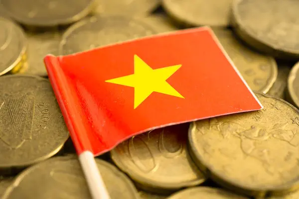 stock image Vietnam flag on gold coins, finance and banking business.