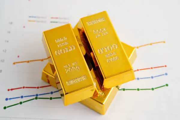 Grafik kağıdında altın külçeleri, finansman ticari yatırım para birimi.