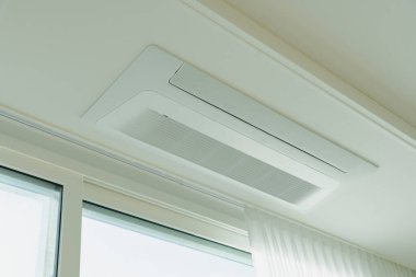 Modern ceiling-mounted air conditioning unit clipart