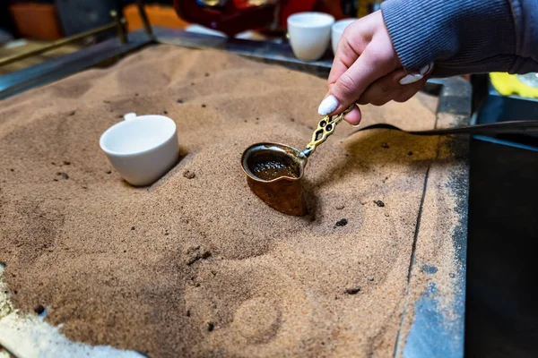 Turkish coffee cooked in sand, Turkish Coffee preparation by street vendor