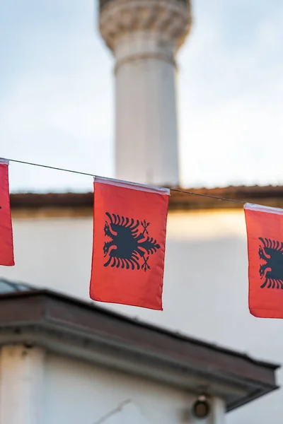 Albanian flag in city, national flag of Albania in street