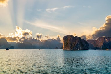 Halong Bay, Vietnam, with limestone hills and sunset sky. landscape of Ha Long bay with sunset sky, a UNESCO world heritage site and a popular tourist destination.