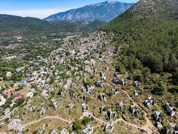 stock image Kayakoy, an abandoned Greek village, near Fethiye, Turkey. Aerial view of historic Greek village abandoned due to population exchange