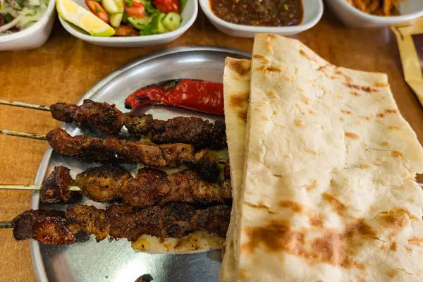 Stock image Ciger Kebabi served in restaurant Diyarbakir. traditional dish from Diyabakir, Turkish. 