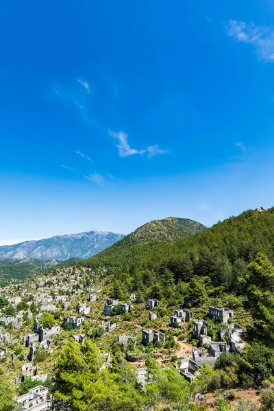 stock image Kayakoy, an abandoned Greek village, near Fethiye, Turkey. Aerial view of historic Greek village abandoned due to population exchange