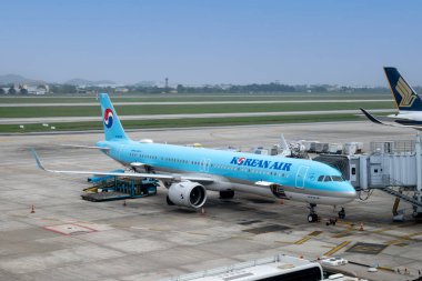 Hanoi, Vietnam - 01.18.2024: Korean Air aircraft on runway at Hanoi Airport. Korean Air is the flag carrier of South Korea and its largest airline. clipart