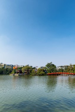 Hoan Kiem lake in Hanoi, Vietnam, with iconic Ngoc Son Temple, downtown Hanoi, Vietnam  clipart