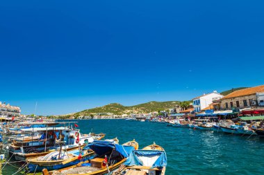 Foca, Turkey - 07.05.2024: Eski Foca waterfront view by harbour on the Aegean coast, Izmir, Turkey. Eski Foca is a popular seaside resort town in Turkey clipart