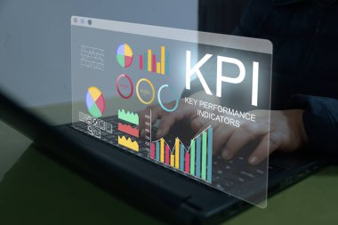 Analyst working with Business Analytics and Data Management System on computer to make report with KPI and metrics connected to database. Corporate strategy for finance, operations, sales, marketing