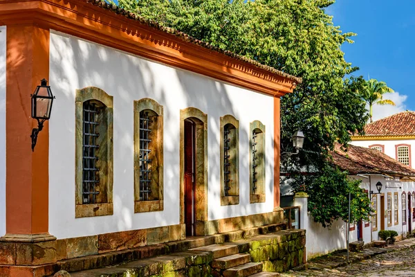 stock image Facade of old colorful colonial houses on a cobbled street in the historic city of Tiradentes in Minas Gerais