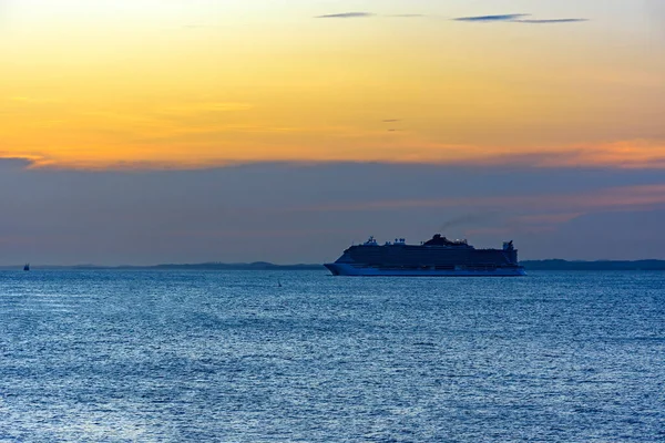 Stunning luxury ship arriving in the city of Salvador in Bahia during summer sunset