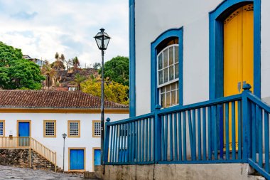 Facade of old houses in colonial style in the historic streets and slopes of the city of Diamantina in Minas Gerais, Brazil