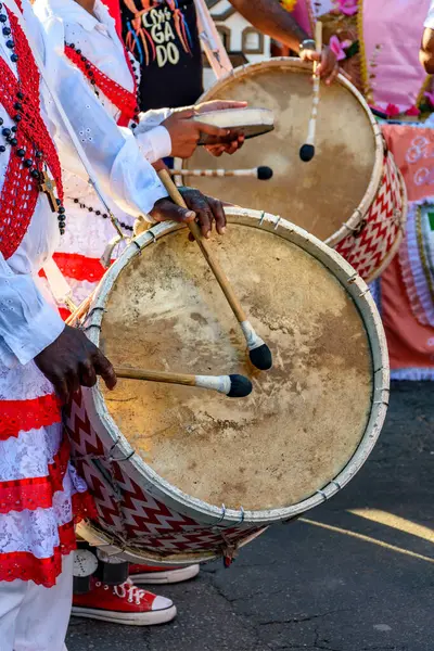 stock image Drummers with rustic and colorful wooden drums at an Afro-Brazilian cultural event on the streets of Brazil