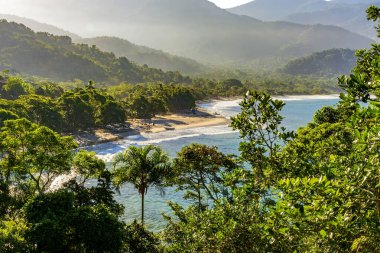 Bonete Beach between mountains, forests and the sea on the island of Ilhabela in Sao Paulo clipart