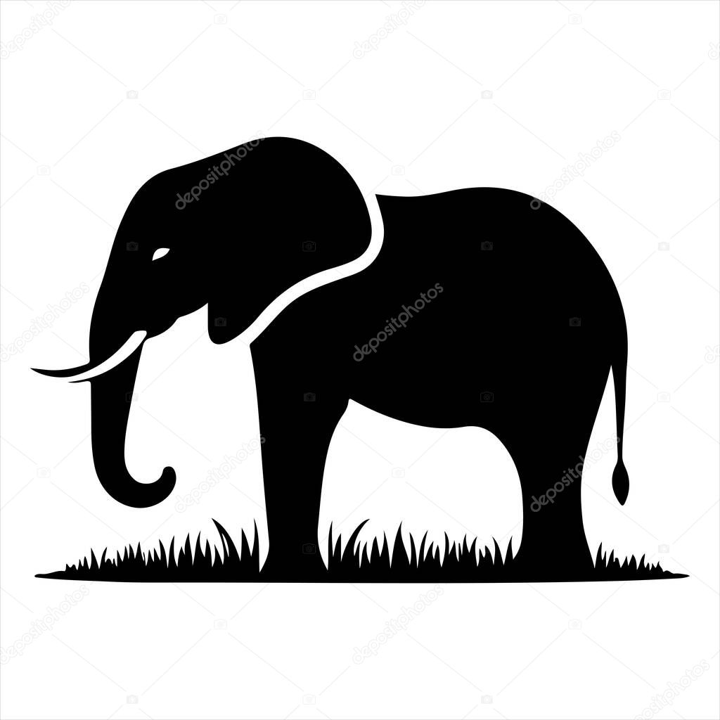 A simple black silhouette of an elephant stands in a patch of grass against a white background.