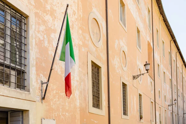 stock image Italian Flag over windows house. Use it for national day and country occasions concept.