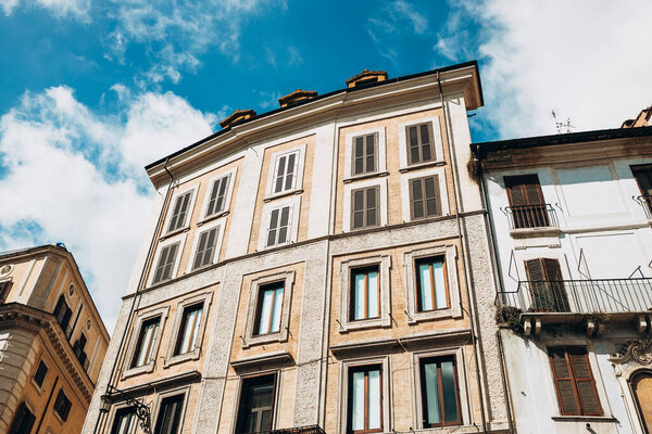 Architecture of Rome. A building with the characteristic facade and windows.