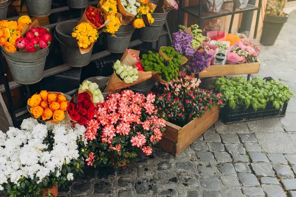 Street flowers store for retail sell. Small business concept. Flower market with various multicolored fresh bouquet