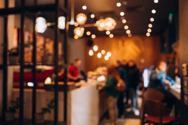 Abstract blur defocus coffee shop cafe or restaurant interior background clipart