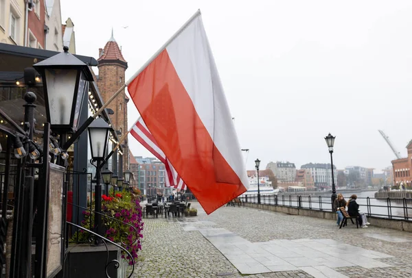 US and Polish flags fluttering in the wind