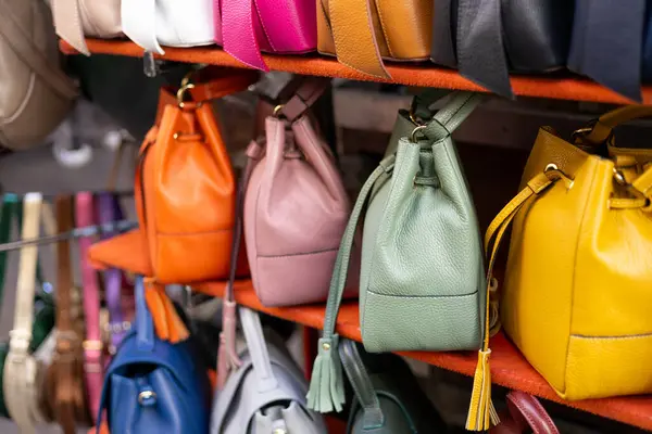 Close up of different leather bags on market