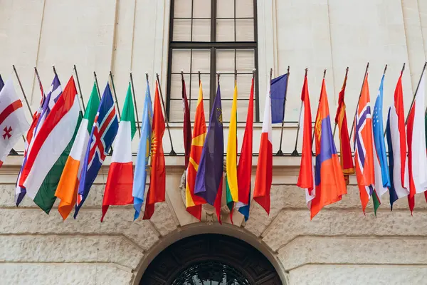 National flags of countries flying in the wind. Colorful flags from different countries. Flags Organization for Security and Co-operation in Europe