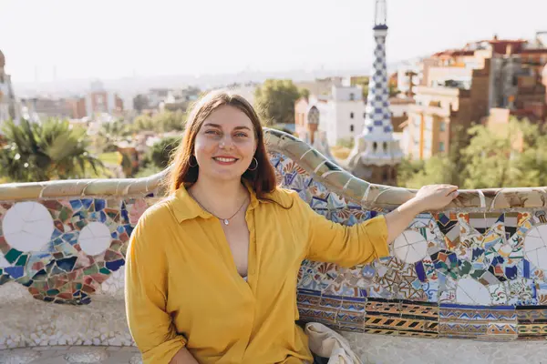 stock image Woman 30s tourist having fun visiting famous Guell park in Barcelona. Concept of travel, tourism and vacation in city