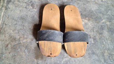 Vintage Javanese Wooden Sandals  Traditional Indonesian Bakiak Footwear with Recycled Rubber Straps, Unique and Durable Rural Handmade Shoes clipart