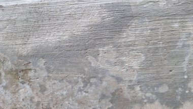 Hışırtılı beton doku, yıpranmış taş yüzey, eskimiş duvar arkaplanı, sert çimento kalıpları ve soyut endüstriyel doku tasarım elementi.