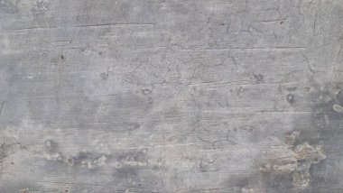 Eski grunge beton yüzey eskimiş çimento dokusu ve kaba taş desenleri, endüstriyel arka planlar için ideal.