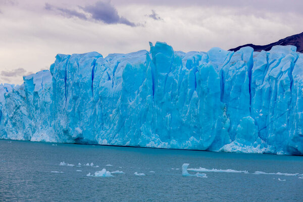 Perito Moreno glacier blue ice in Patagonia, Argentina. Patagonian beautiful mountain scenery of the national park Los Glaciares on the border Argentina and Chile stunning glacier ice landscape