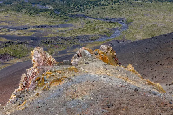 stock image Osorno volcano mountain summit in Chile, Patagonia Andes. The ring of fire volcanic landscape with crater and lava active volcano in South America. Red rock frozen lava and snow on volcano top