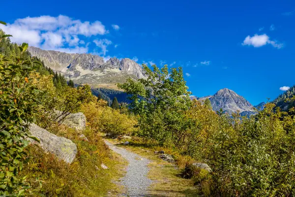 Stock image Tour du Montblanc beautiful mountain ladscapes of the Alps green valley, snow summit of Montblanc and rocky peaks of Aiguille du Midi in summer sunny weather blue sky, trekking and hiking in Chamonix