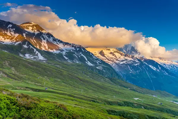 Stock image Tour du Montblanc beautiful mountain ladscapes of the Alps green valley, snow summit of Montblanc and rocky peaks of Aiguille du Midi in summer sunny weather blue sky, trekking and hiking in Chamonix