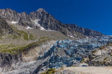 Mountain landscape of the Alps in Chamonix valley, France. Alpine scenery in summer sunny weather on Tour du Montblanc, TMB trekking route clipart