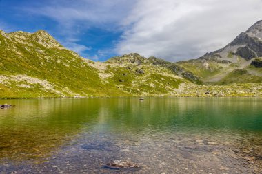 Alps mountains beautiful landscape. Tour du Montblanc alpine scenic views of the mountain summits and lakes in the beautiful light in summer, french Alps