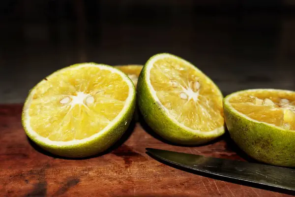 Stock image Citrus limetta, or sweet lime, offers a refreshing blend of sweet and tangy flavors with a vibrant green-yellow hue. Its juicy flesh and citrus aroma make it a prized fruit for both culinary and health benefits.