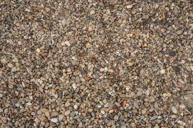 Danimarka 'da, 24 Eylül 2024' te, arka plan dokusu olarak kullanmak için kumsalda duran küçük çakıl taşlarından oluşan bir model.