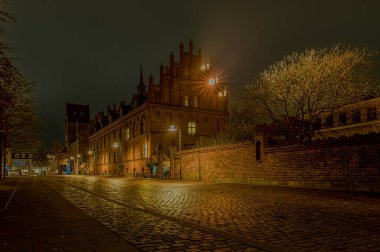 Roskilde town hall and square at night in a soft light, Denmark, November 7, 2024 clipart