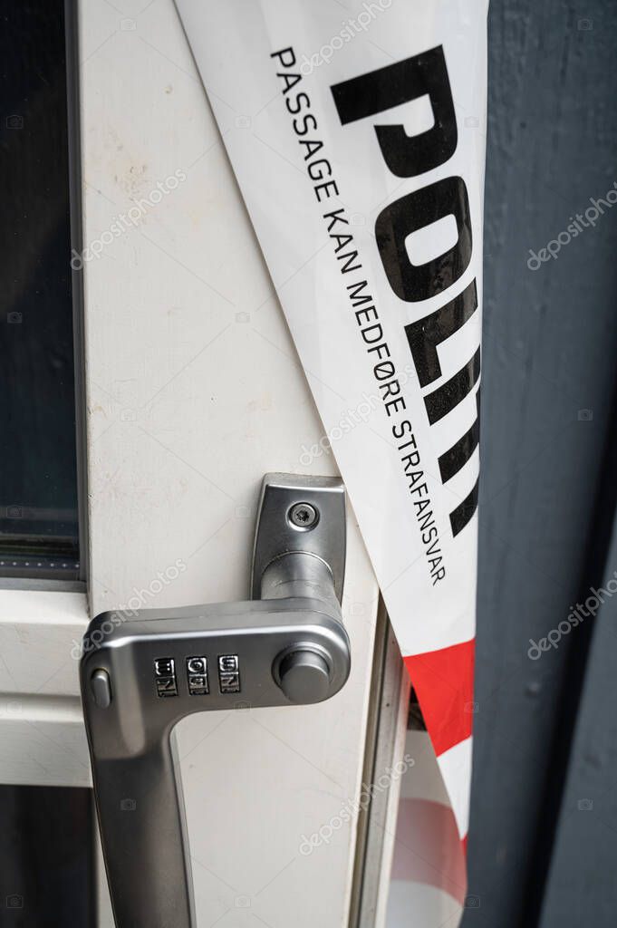 Terrace door with a combination lock and a danish sign. Stop Police