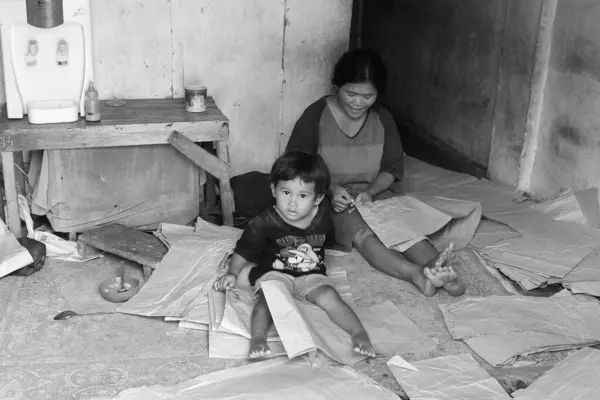 stock image life of urban communities living near the railroad tracks, children of workers, schools taken in Malang Add on June 6 2024