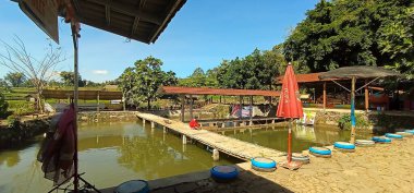 fishing pond and place to eat grilled fish, add on June 2024 located in Magetan Indonesia clipart