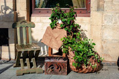 Massive wooden chair near the walls of the cafe.