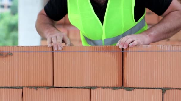 Mason Seals Stacked Brick His Fist Building Wall Construction Bricks — Stock Video