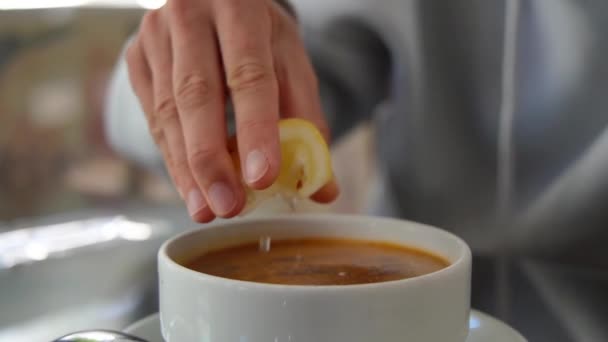 Woman Hand Squeezes Fresh Lemon Bowl Turkish Lentil Soup Close — Stock Video