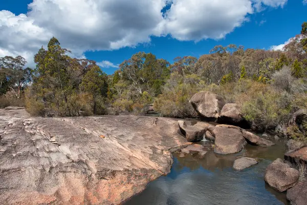 stock image bushwalking adventure in Girraween National Park, South East Queensland, Australia. Discover granite outcrops, lush forests, and wildflower-strewn trails in this picturesque natural paradise