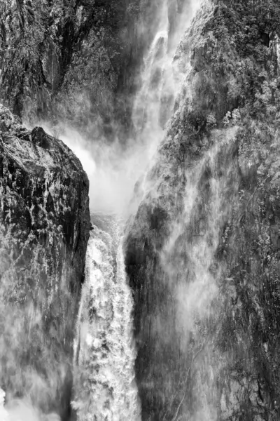 stock image the spectacular Barron Falls near Kuranda, FNQ, Australia, in full flow during the wet season. Marvel at the powerful cascade of water surrounded by lush rainforest, creating a breathtaking and dramatic natural spectacle