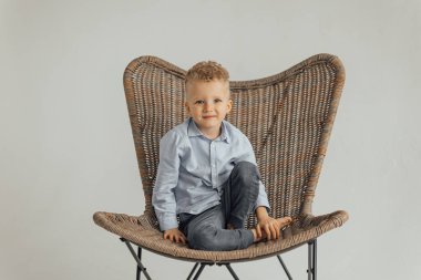 little boy, 4 years old, blond in a shirt