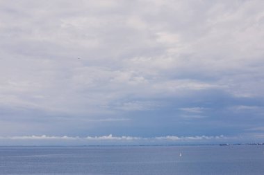 Landscape Long exposure of majestic clouds in the sky sunset or sunrise over sea with reflection in the tropical sea.Beautiful cloudscape scenery.Amazing light of nature Landscape nature background